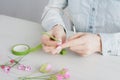 Florist does a wreath with artificial flowers from Foamiran Royalty Free Stock Photo