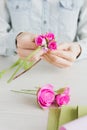 Florist does a wreath with artificial flowers from Foamiran