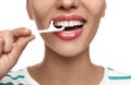 Young woman flossing her teeth on white background, closeup. Cosmetic dentistry Royalty Free Stock Photo