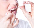 Young woman flossing teeth Royalty Free Stock Photo