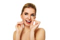 Young woman flossing teeth. Royalty Free Stock Photo
