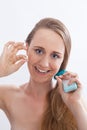 Young Woman Flossing Teeth in White Studio Royalty Free Stock Photo