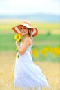 Young woman on flower field in summer Royalty Free Stock Photo