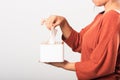 Hand taking pulling white facial tissue out of from a white box Royalty Free Stock Photo