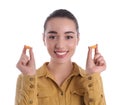 Young woman with foam ear plugs on white background Royalty Free Stock Photo