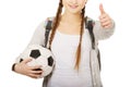 Young woman with foot ball. Royalty Free Stock Photo