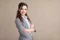 Young woman in formal clothes on color background