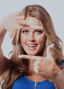 Young woman frame her face with hands. Royalty Free Stock Photo