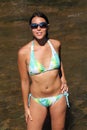 Young woman with freckles bikini at river