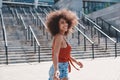 Young woman free style on the street running near stairs looking Royalty Free Stock Photo