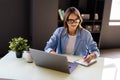 Young woman freelancer female hands with pen writing on notebook at home or office Royalty Free Stock Photo