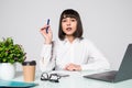 Young woman freelancer female hands with pen writing on notebook in office Royalty Free Stock Photo