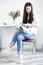 Young woman freelancer indoors home, office concept, taking notes in planner, close-up Royalty Free Stock Photo