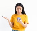 Young woman freelancer looking worried at mobile phone reading bad news on email loss trouble concept Royalty Free Stock Photo