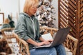 Young woman freelancer working on computer at home, studying online, or shopping in internet store.