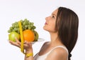 Young woman with fresh fruit and tape measure Royalty Free Stock Photo