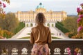 Young woman in front of Belvedere palace in Vienna, Austria, Female tourists standing in front of the Schonbrunn royal palace