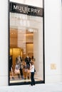 Young woman in front of luxury fashion storefront in Vienna