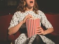 Young woman on front row of movie theater Royalty Free Stock Photo