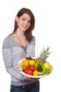 Young woman with fruit-filled bowl in their hands