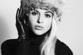 Young Woman in Fur Hat. Beautiful Blond Girl in Black Leather Gloves. Winter Fashion Royalty Free Stock Photo