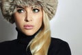 Young Woman in Fur Hat. Beautiful Blond Girl. Winter Fashion Beauty.Autumn.Healt hy hair