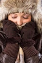 Young woman with fur hat, scarf and gloves