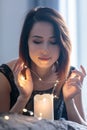 Young woman with garland and candle Royalty Free Stock Photo