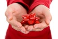 Young woman gently holding red ribbon