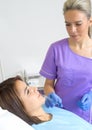 Young Woman Geting an Injection in her Lips in Beauty salon