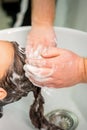 Young woman gets hair wash