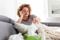 Young woman getting bad news by phone. unhappy woman talking on mobile phone looking down. Crying depressed girl holds phone Royalty Free Stock Photo