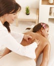 Young woman getting deep tissue massage Royalty Free Stock Photo