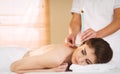 Young woman getting ear candling treatment