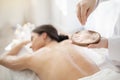 Young Woman Getting Exfoliation Scrub Treatment In Modern Spa Royalty Free Stock Photo