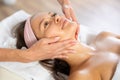 Young woman getting facial massage in salon Royalty Free Stock Photo