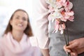 Young woman getting flowers from boyfriend Royalty Free Stock Photo