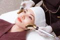 Young woman getting her beauty treatment by a doctor at a beauty clinic