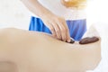 Young woman getting hot stone massage in spa salon Royalty Free Stock Photo