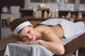 Young woman getting lastone therapy in spa Royalty Free Stock Photo