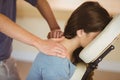 Young woman getting massage in chair