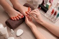 Young woman getting professional pedicure in beauty salon Royalty Free Stock Photo