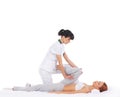 A young woman getting a traditional Thai massage Royalty Free Stock Photo