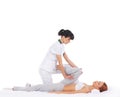 A young woman getting a traditional Thai massage