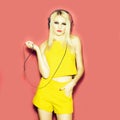 Pretty blonde dg girl in headset on pink Royalty Free Stock Photo