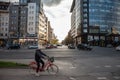 Young woman, a girl, riding a bicycle in the city center of Novi Sad