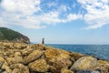 Young woman or girl on a rocky seashorein Alanya resort, Turkey Royalty Free Stock Photo