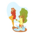 Young woman and girl splashing in puddle, wearing raincoats. Child and adult enjoying rainy weather outdoors, playful