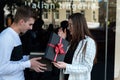 Young woman gives gift to lover. Girl gives present to friend Royalty Free Stock Photo
