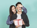 Young woman giving present to boyfriend Royalty Free Stock Photo